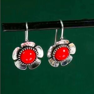 New silver tone flower earrings with red stone